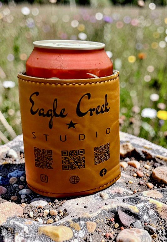 Can with a sleeve featuring 'Eagle Creek Studio' branding on a natural background.